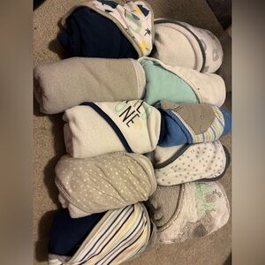 Baby blankets with hoods, one without a hood (grey second from top left)
